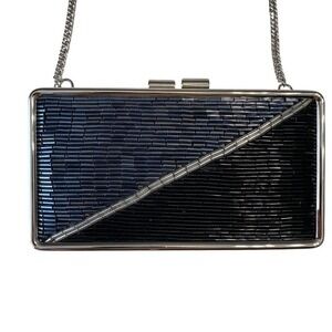 Black and silver beaded clutch bag with silver crossbody chain strap